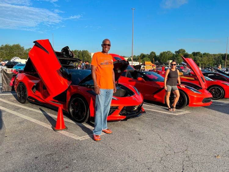 Orange 2021 and 2019 Corvettes