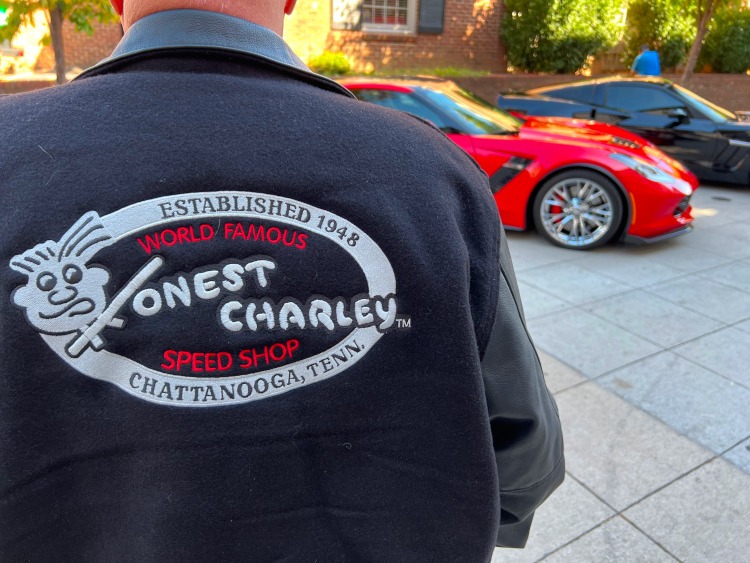Man wearing Honest Charley Speed Shop logo on jacket
