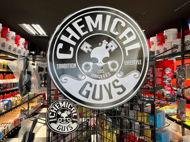 Chemical Guys logo sign inside a product store.