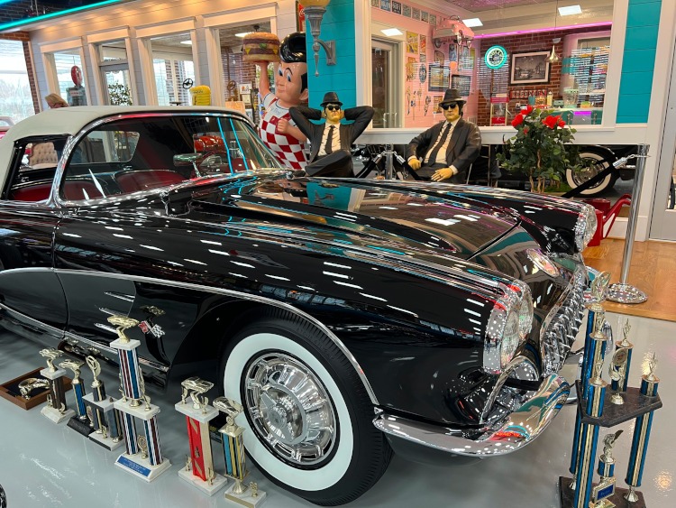 Classic black Corvette inside a car museum