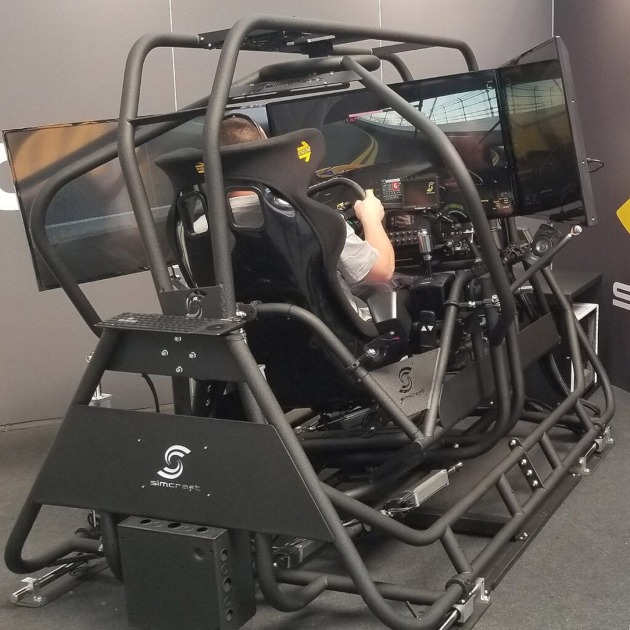 A man inside a racing simulator.