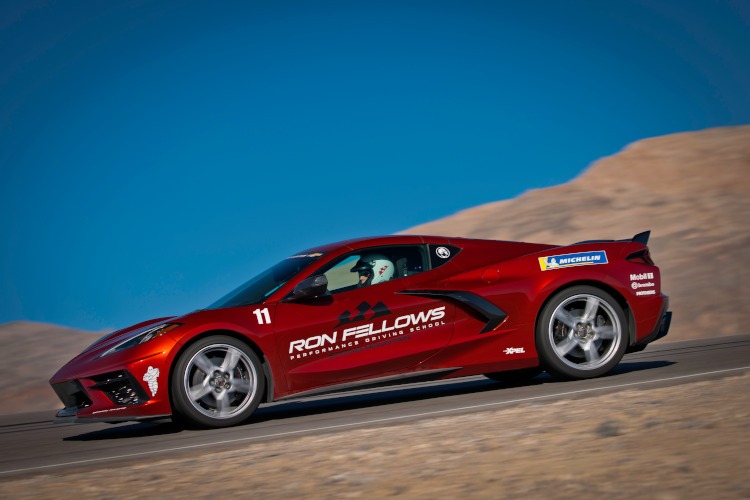 Crystal Red C8 Corvette on a road course.