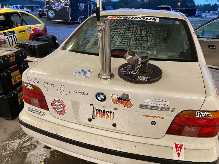 Beer tap mounted on car trunk lid.