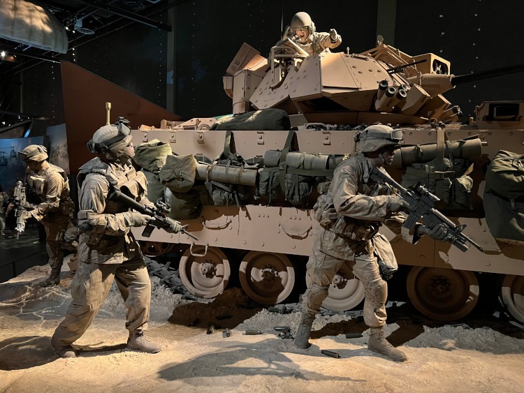 A static display of a tank and ground crew at the U.S. Infantry Museum
