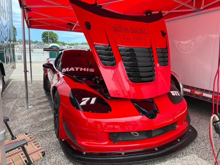 Red Corvette race car at an HSR event.
