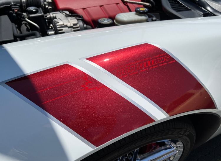 The front racing stripes of a Ron Fellows edition 427 engine Corvette.