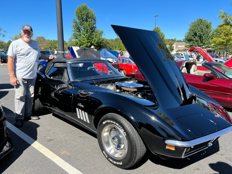 A third-generation all black Corvette convertible.