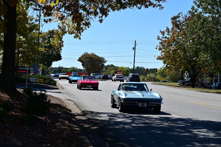 A group of classic Corvettes cruising the streets of Marietta, Ga.