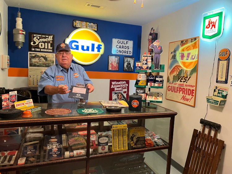 A man wearing a vintage Gulf gas station shirt