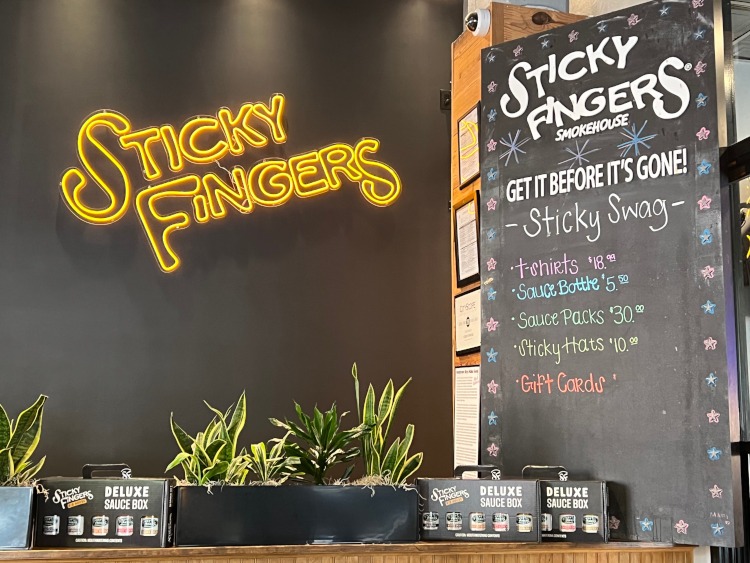 A Sticky Fingers restaurant sign.