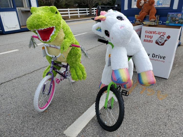 Stuffed animals riding bicycles.