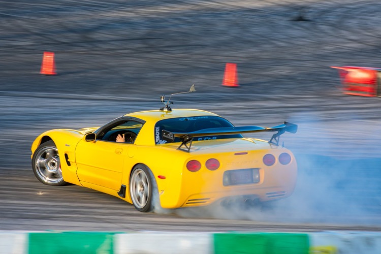The backside of a Corvette drifting.