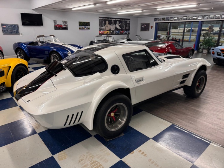 1963 Corvette Grand Sport replica car in a showroom.